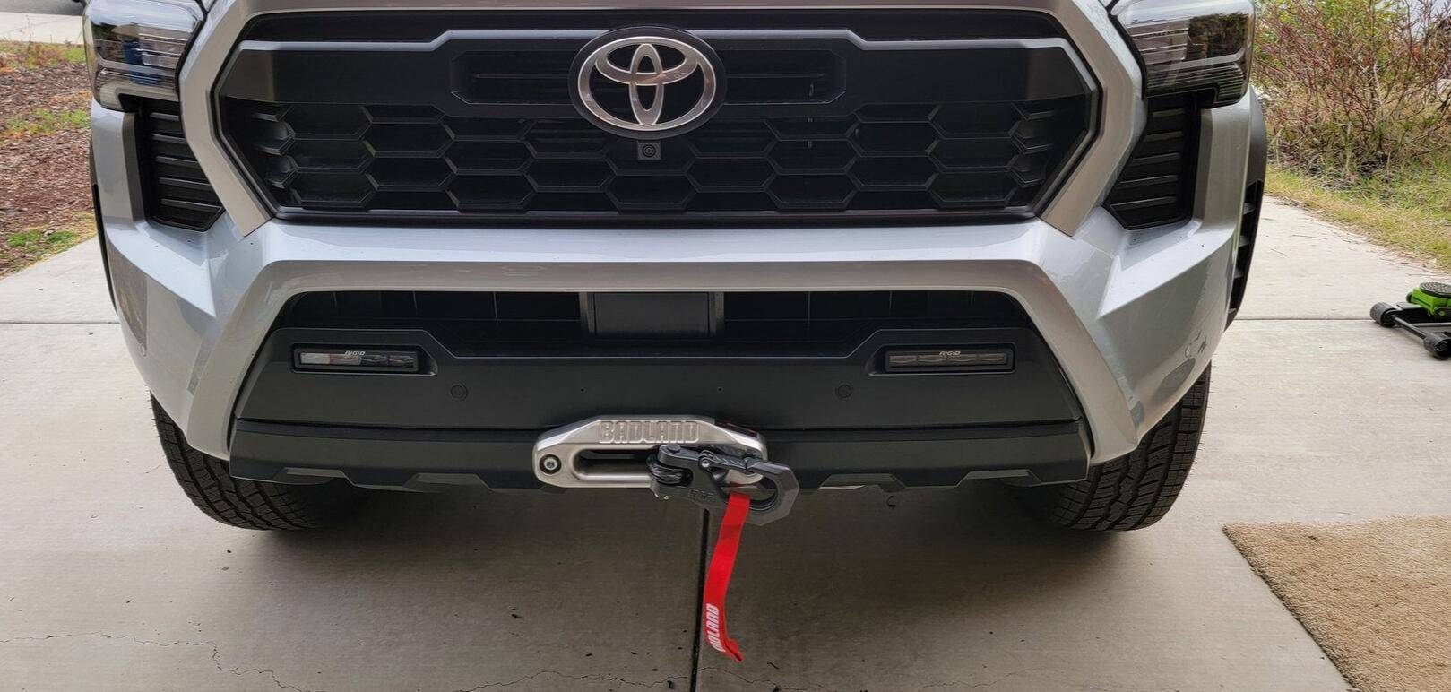 2024 Tacoma Rough Country Winch Mount + Badlands 12k (HF) install on a 4th Gen 2024 Tacoma Hybrid TRD Off-Road. Minimal trimming, huge PITA, but yessir! 1743365712401-6d