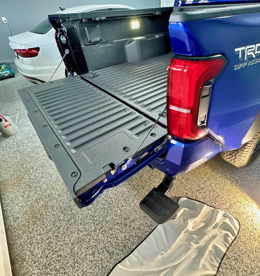 2024 Tacoma Accessories Installed: exhaust tip, bed step, bed cargo divider (molle style) 2024 tacoma bed step accessory 3
