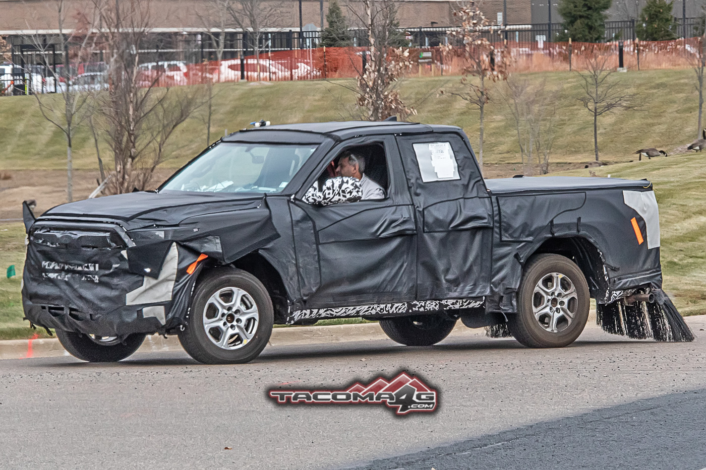 2024 Tacoma Spied: 2024 Toyota Tacoma Mule Reveals Partial Headlights, Grille and Hybrid Clues 2024-toyota-tacoma-front-fascia-slip-hybrid-clues-3