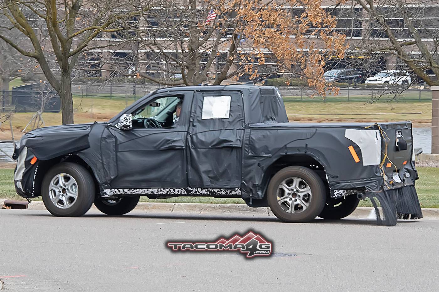 2024 Tacoma Spied: 2024 Toyota Tacoma Mule Reveals Partial Headlights, Grille and Hybrid Clues 2024-toyota-tacoma-front-fascia-slip-hybrid-clues-5