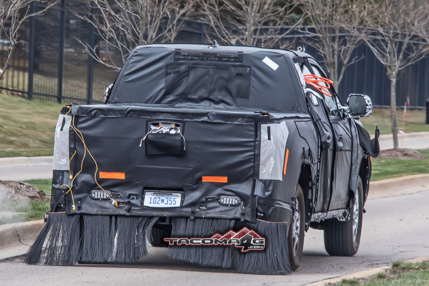 2024 Tacoma Spied: 2024 Toyota Tacoma Mule Reveals Partial Headlights, Grille and Hybrid Clues 2024-toyota-tacoma-front-fascia-slip-hybrid-clues-6
