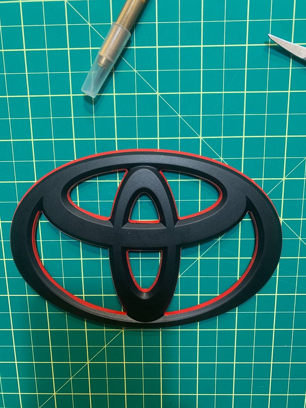 2024 Tacoma Blackout badge customized with red accent 30F0DE07-5BDE-4F64-907C-6CFFF60C53C9