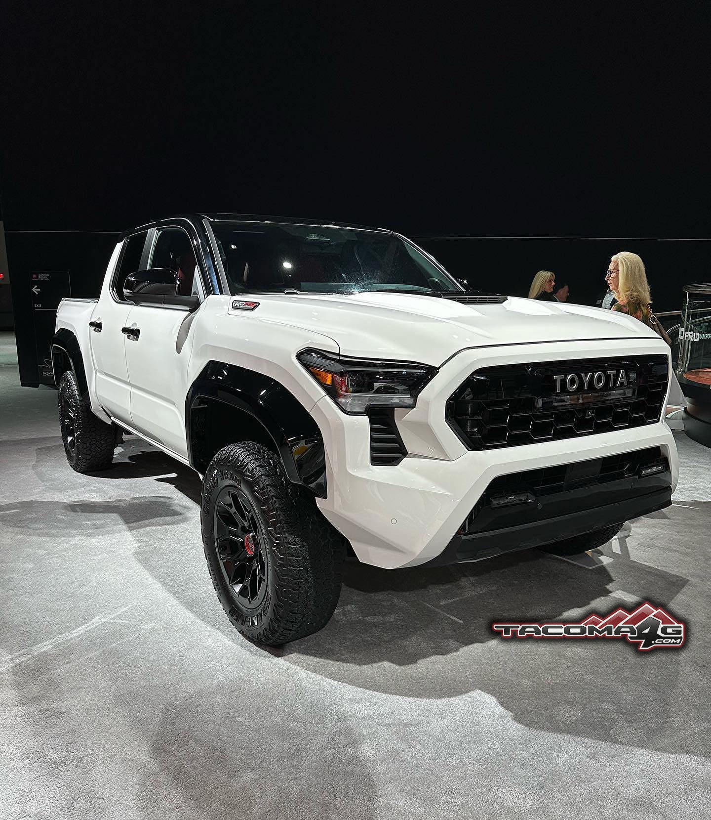 2024 Tacoma Bronze Oxide Trailhunter + Ice Cap White TRD Pro 2024 Tacomas @ Toyota National Dealer Meeting Ice cap white 2024 toyota tacoma trd pro