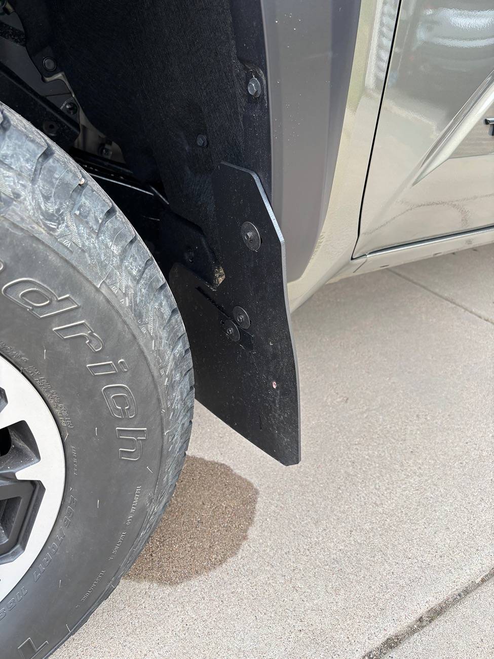 2024 Tacoma Has anyone tried RekGen universal Mud Flaps? Specifically for a Trailhunter? IMG_1180