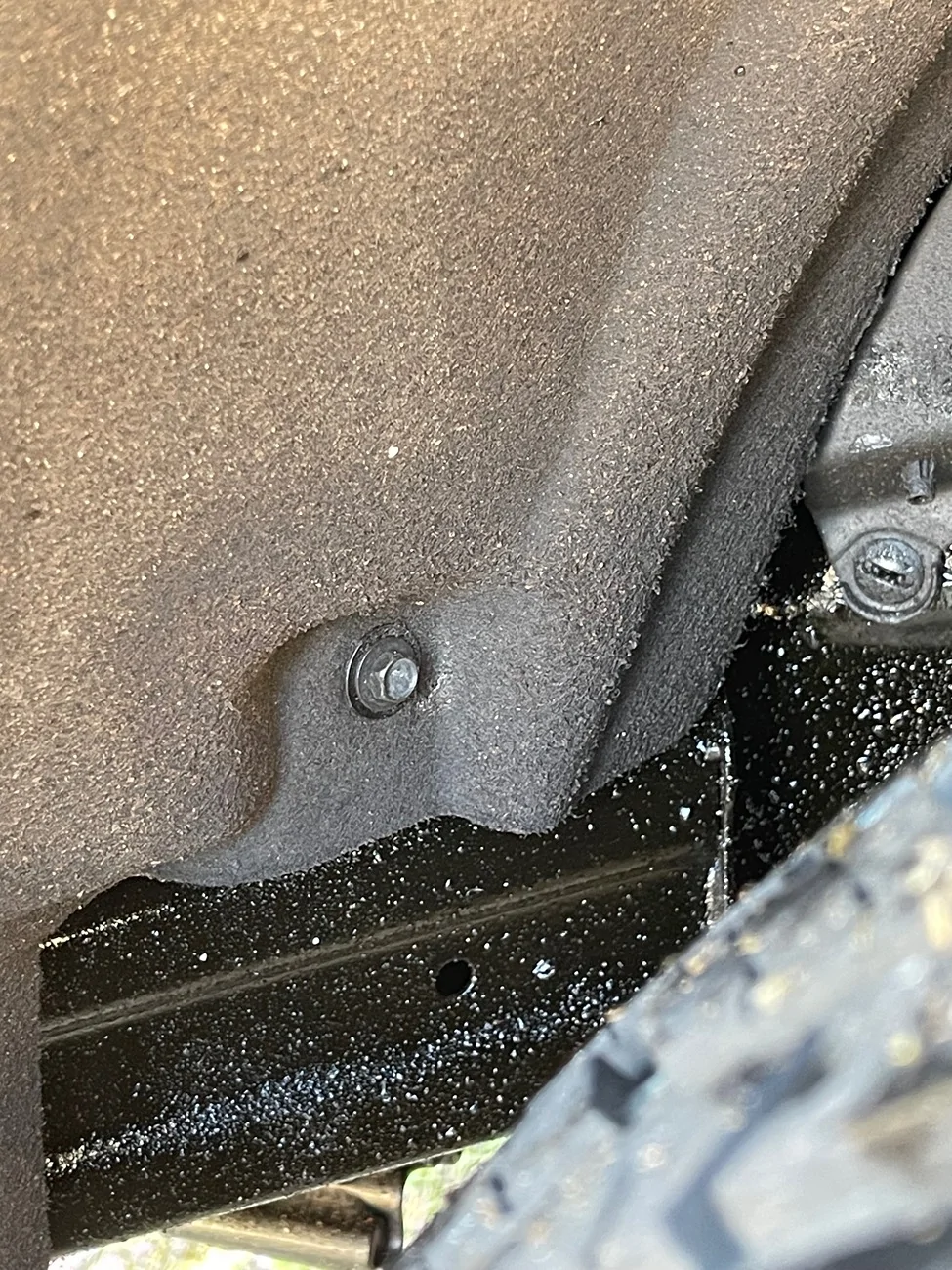 2024 Tacoma Wheel arc liner / carpet, mudflap bolt IMG_1220