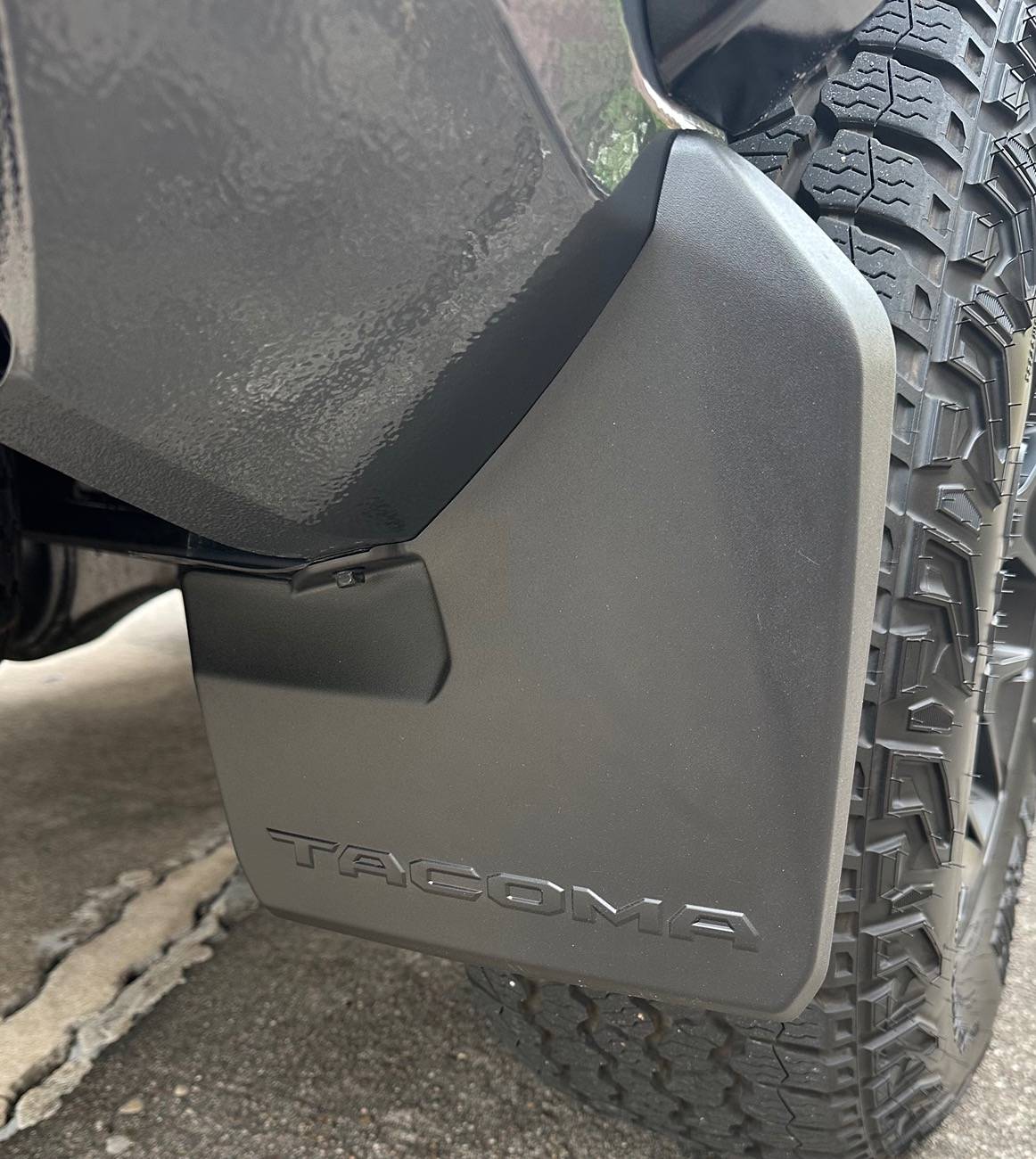 2024 Tacoma OEM mudflaps. Canada vs US. IMG_4519