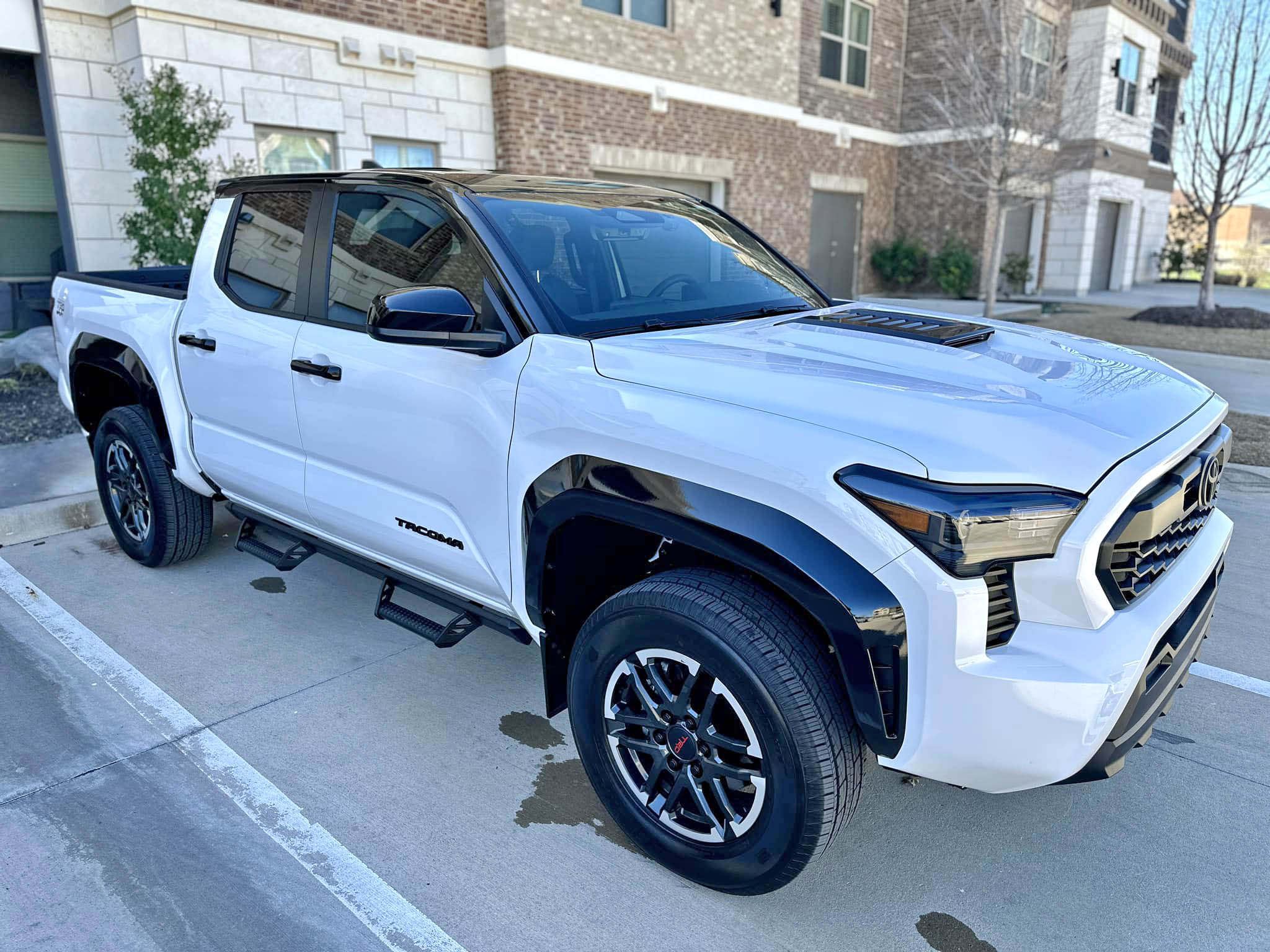 2024 Tacoma Gloss black wrap roof, fender flares and mirrors for a 2024 TRD PRO look Roof Wrap + Fender Flare Wrapped in Black for a 2024 TRD PRO look 1