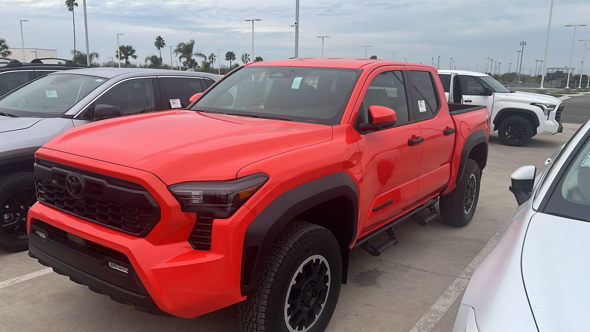 2024 Tacoma Updates of 2024 Tacomas on dealer lots (dealership, pricing, photos) Solar Octane 2024 Tacoma TRD Off-Road interior & exterior at dealership 10