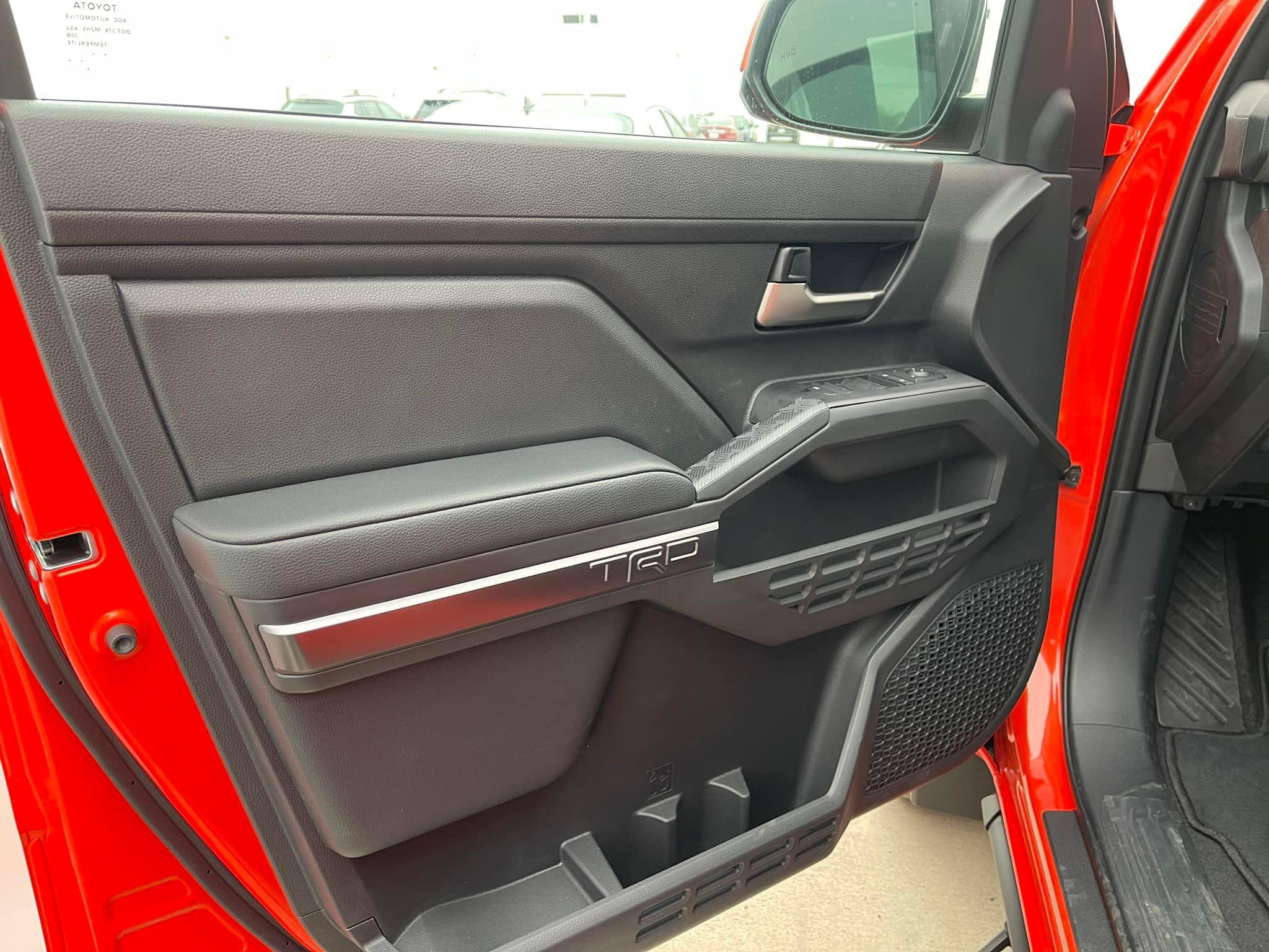 2024 Tacoma Updates of 2024 Tacomas on dealer lots (dealership, pricing, photos) Solar Octane 2024 Tacoma TRD Off-Road interior & exterior at dealership 6