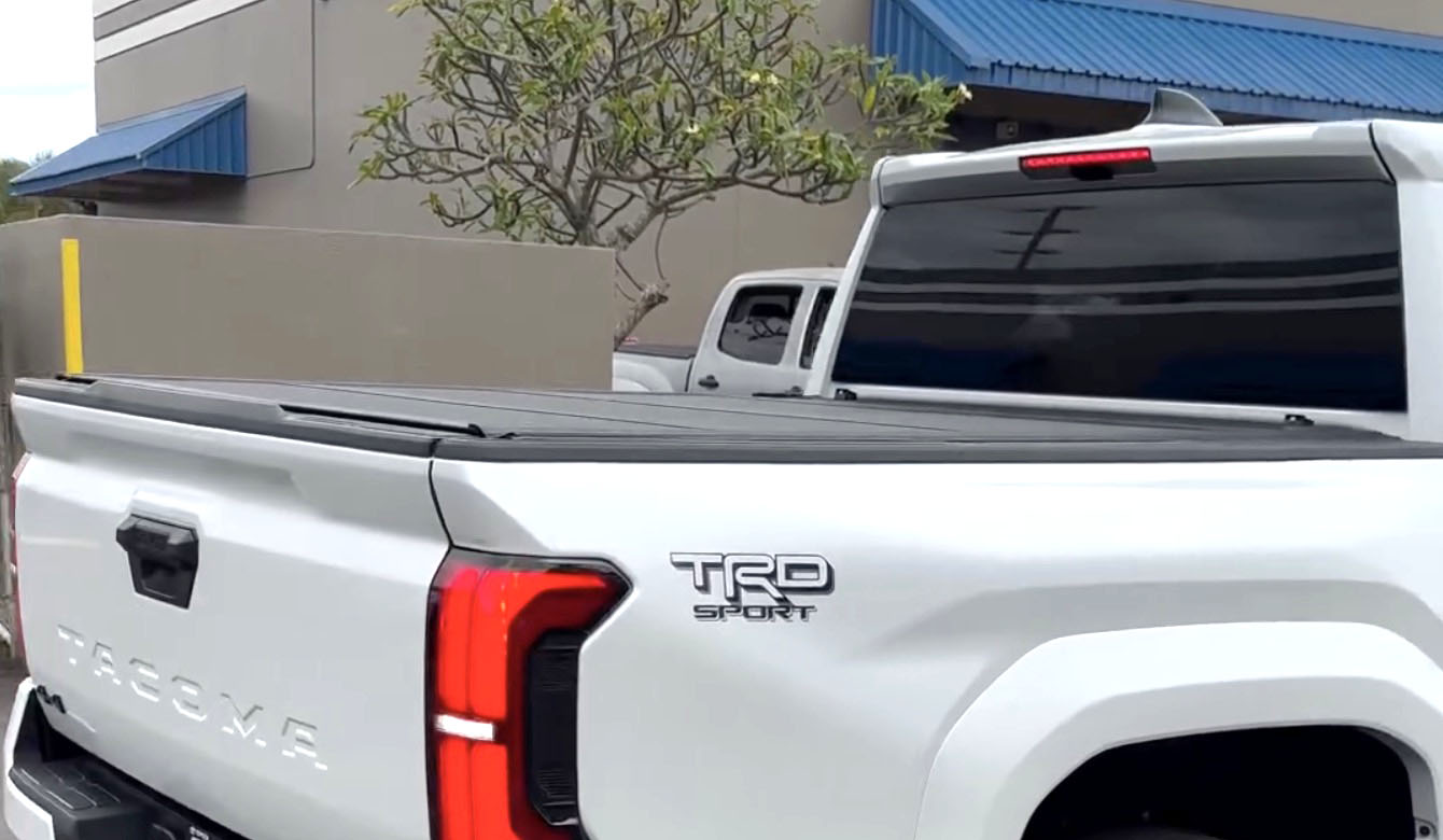 2024 Tacoma OEM Trifold Hard Tonneau Cover installed on 4th Gen Tacoma - spotted in Hawaii Toyota OEM Trifold Hard Tonneau Cover 1